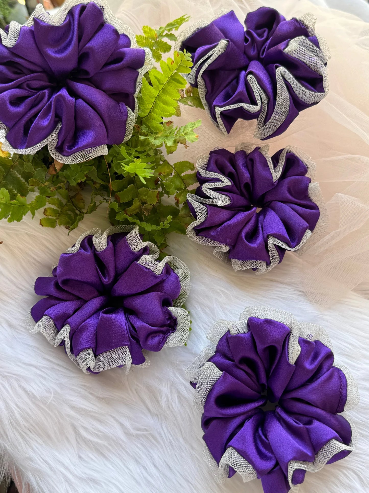 Purple satin scrunchies with silver net borders displayed flat lay, handmade hair accessories by Bows and Bags India