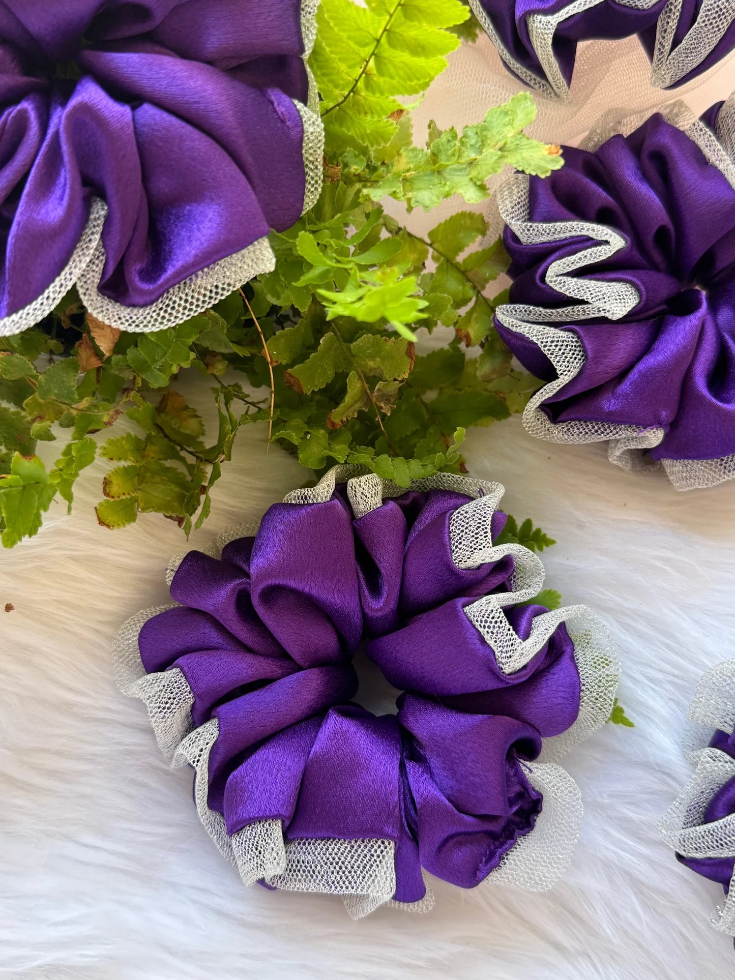 Purple satin scrunchie with silver net border detail by Bows and Bags India, handmade hair accessory with greenery styling