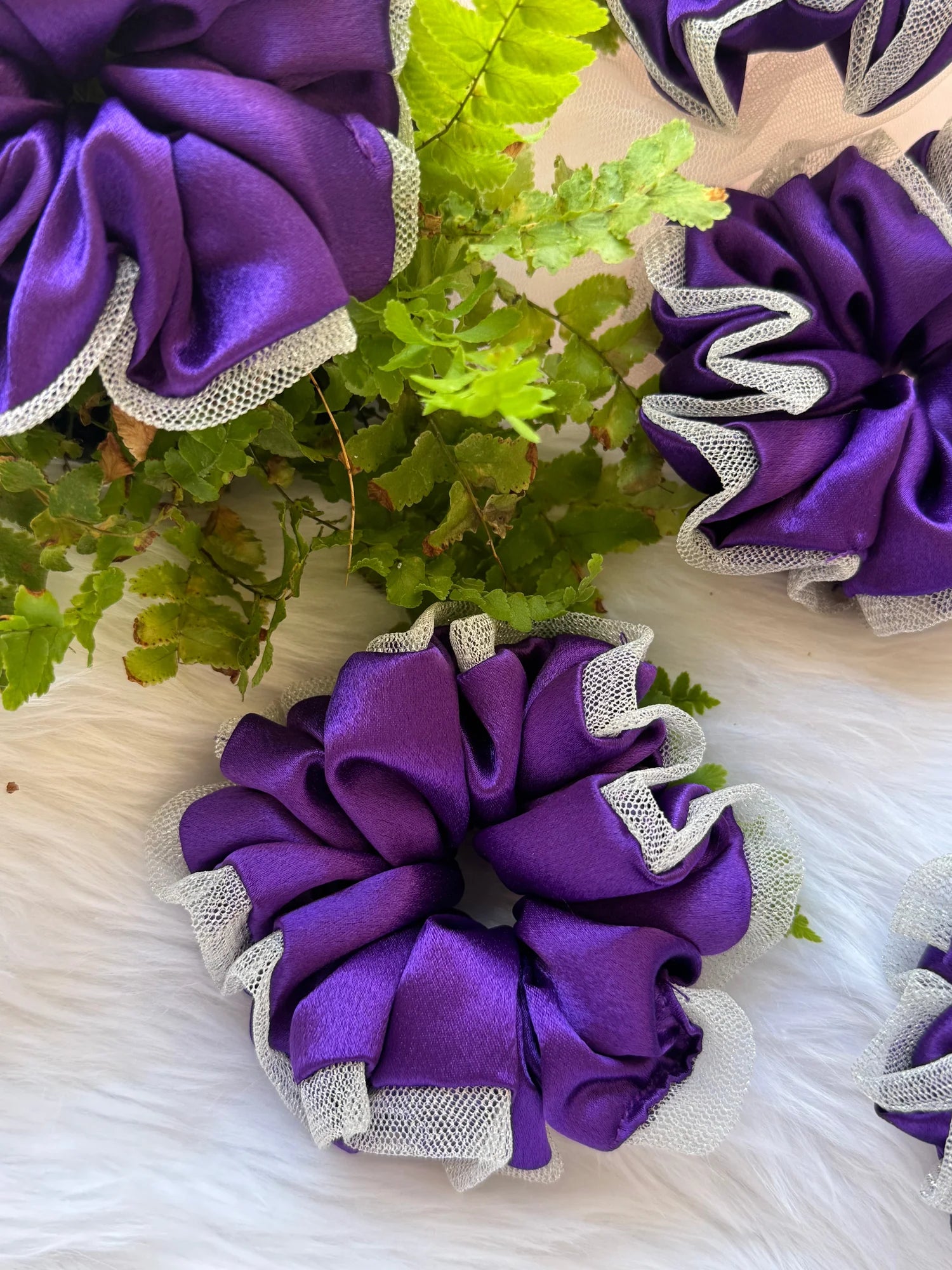 Purple satin scrunchie with silver net border detail by Bows and Bags India, handmade hair accessory with greenery styling