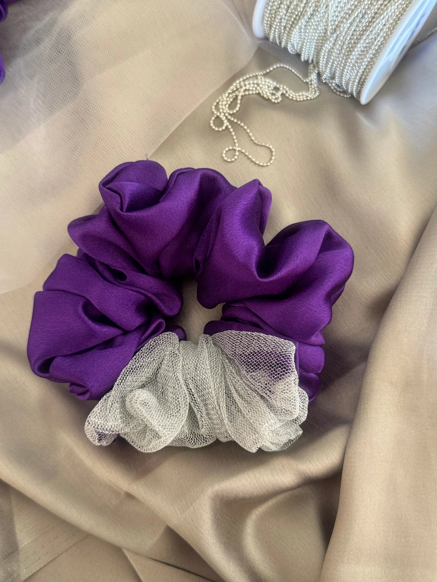 Purple satin and silver net XL scrunchie by Bows and Bags India with pearl beaded chain, handmade hair accessory on cream