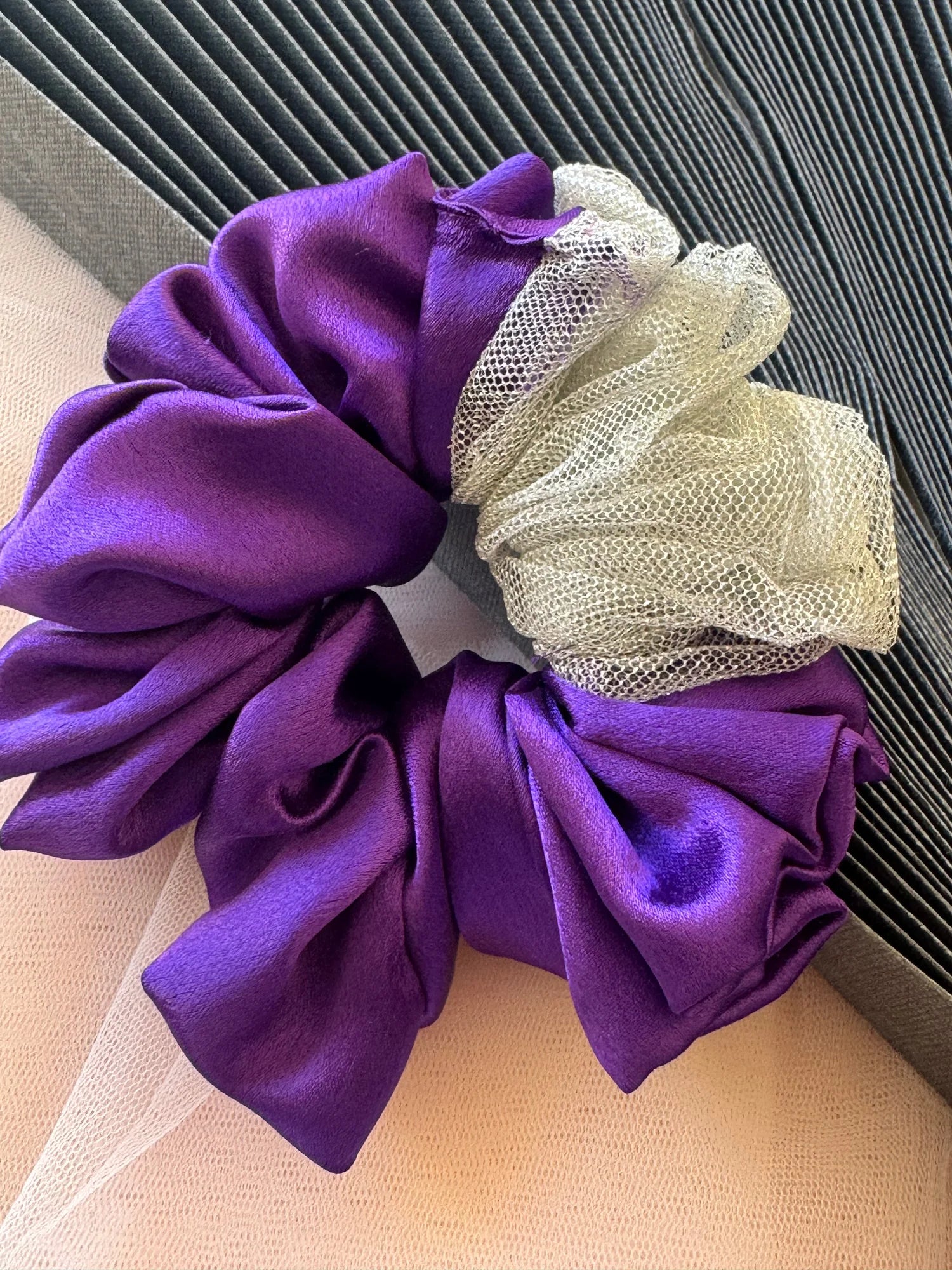 Purple satin and silver net handmade scrunchie XL size by Bows and Bags India displayed on textured fabric background