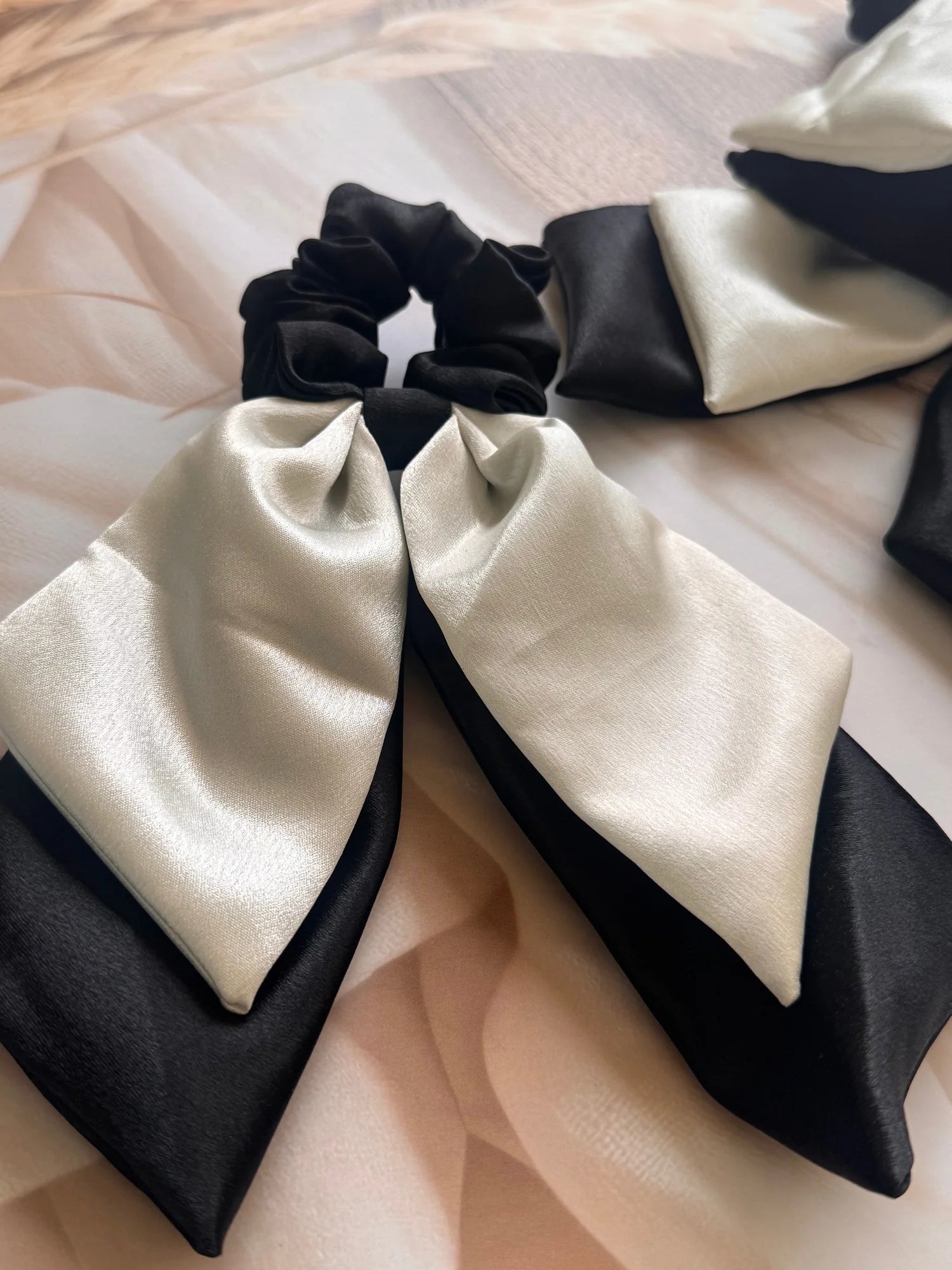 Black and white satin dual long tail scrunchies with elegant bow design by Bows and Bags India, handmade hair accessories