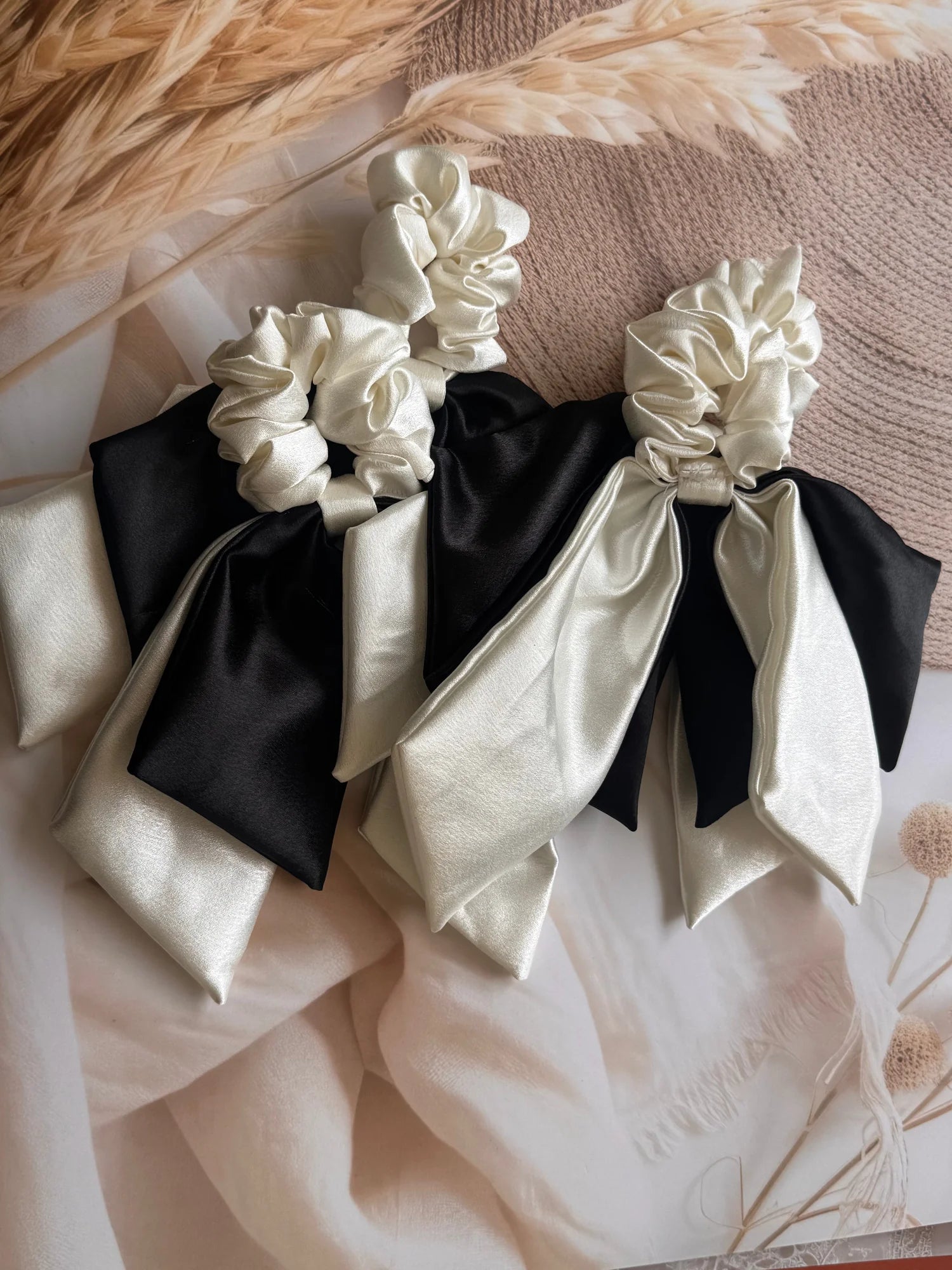 Pearly white and black satin dual tail scrunchies with bow detail by Bows and Bags India, handmade hair accessories