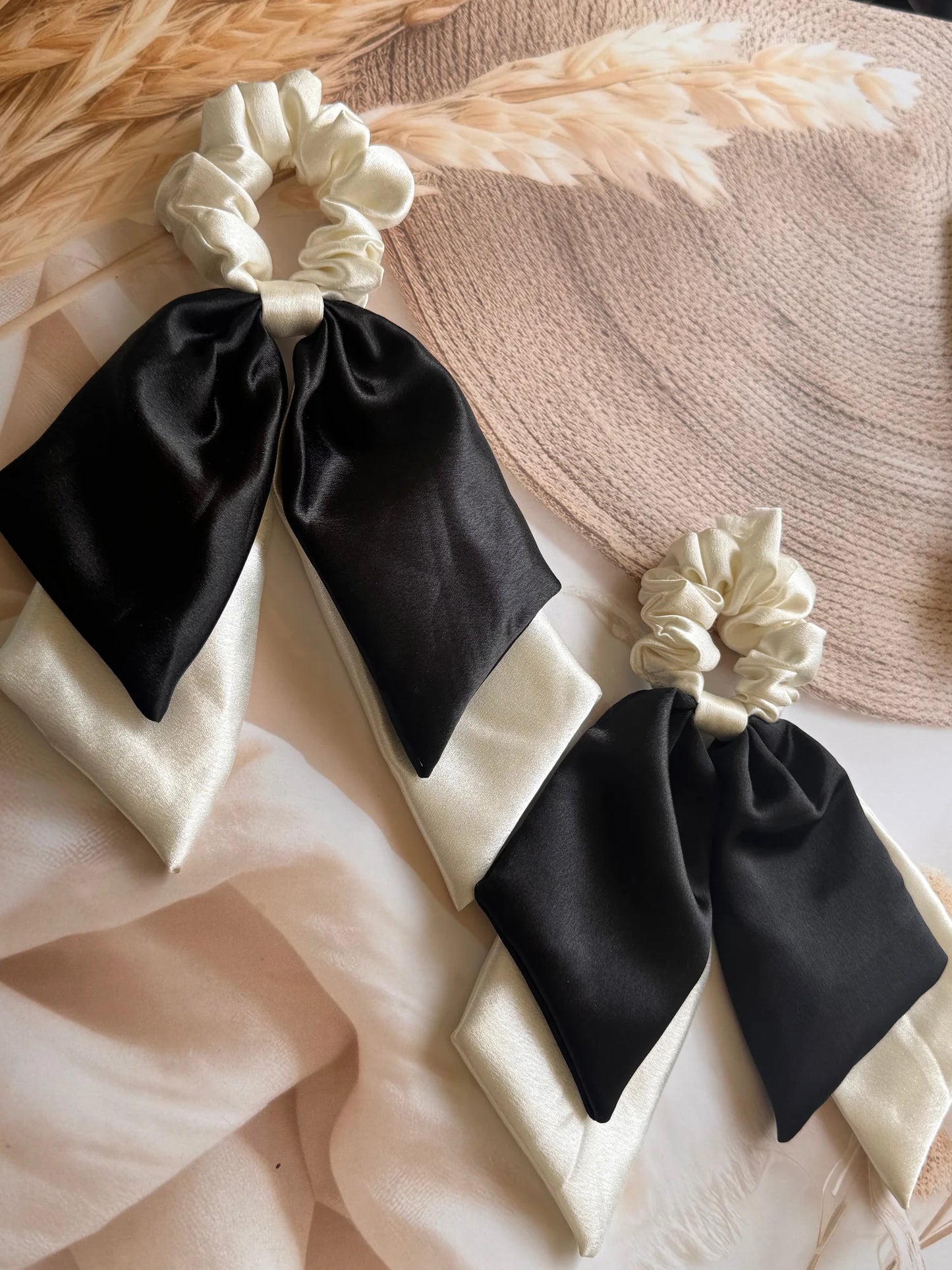 Pearly white and black satin dual long tail scrunchies with elegant bow details by Bows and Bags India, handmade hair