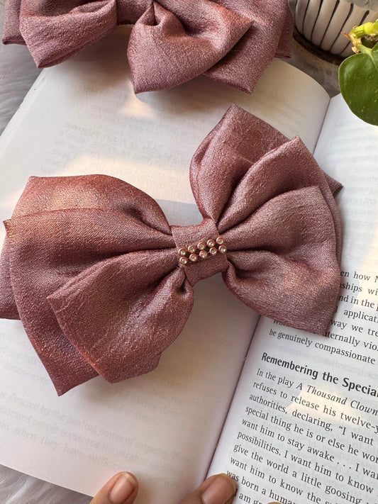 Rose gold silk hair bow with stone embellishment on book, Bows and Bags India handmade accessory