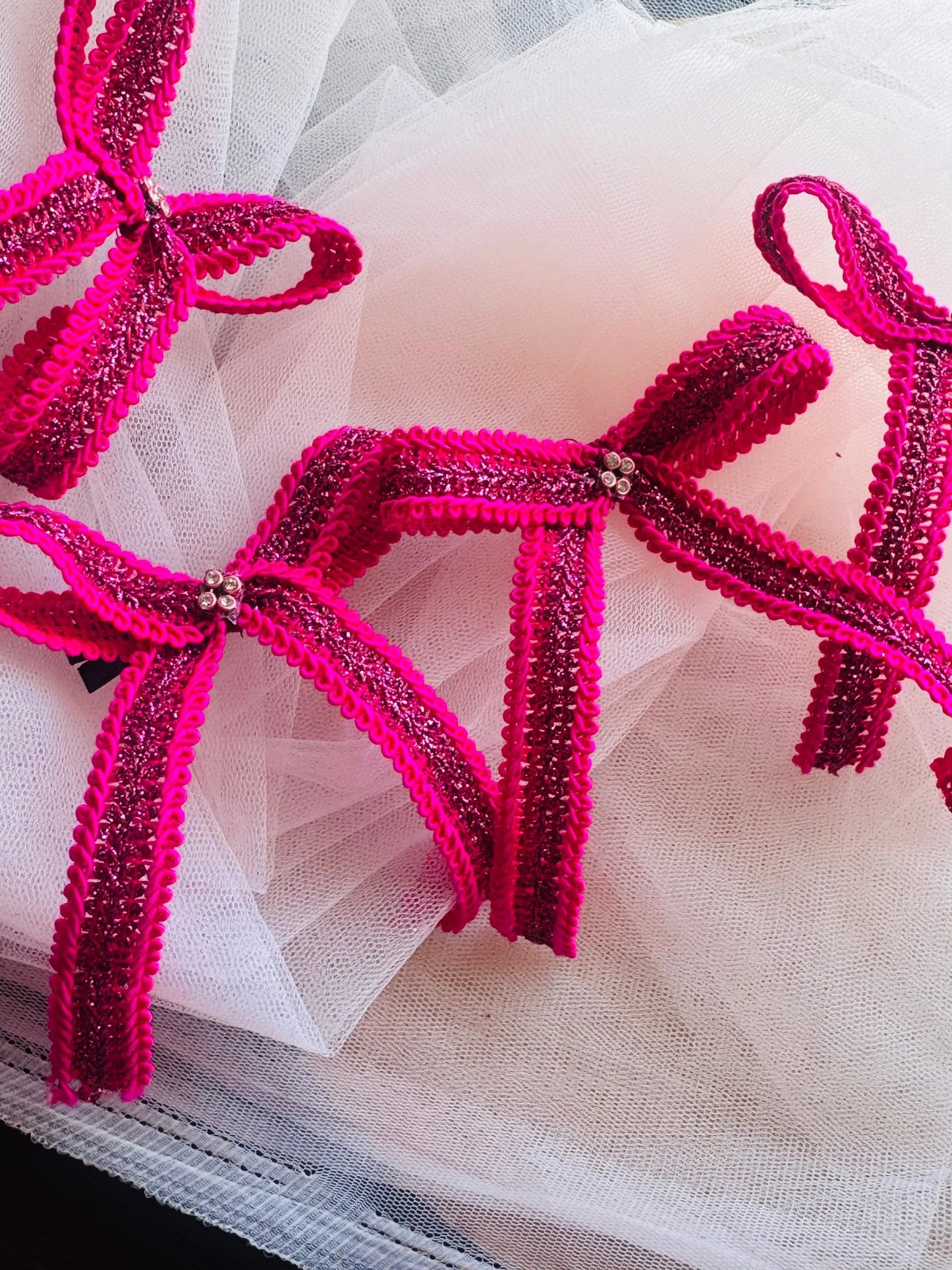 Rose Roosevelt handmade pink hair bow clip with purple gold glitter detail by Bows and Bags India, close-up texture view