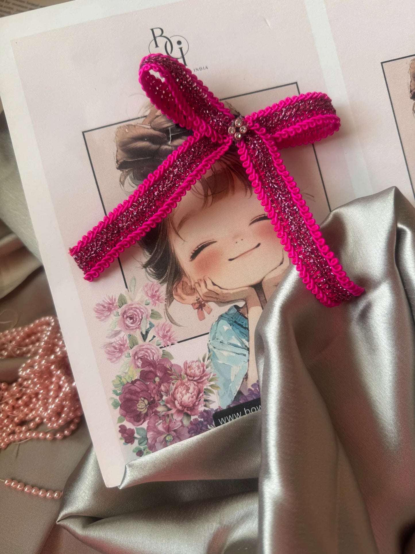 Rose Roosevelt handmade hair bow clip in hot pink with gold glitter detailing by Bows and Bags India, styled on illustrated