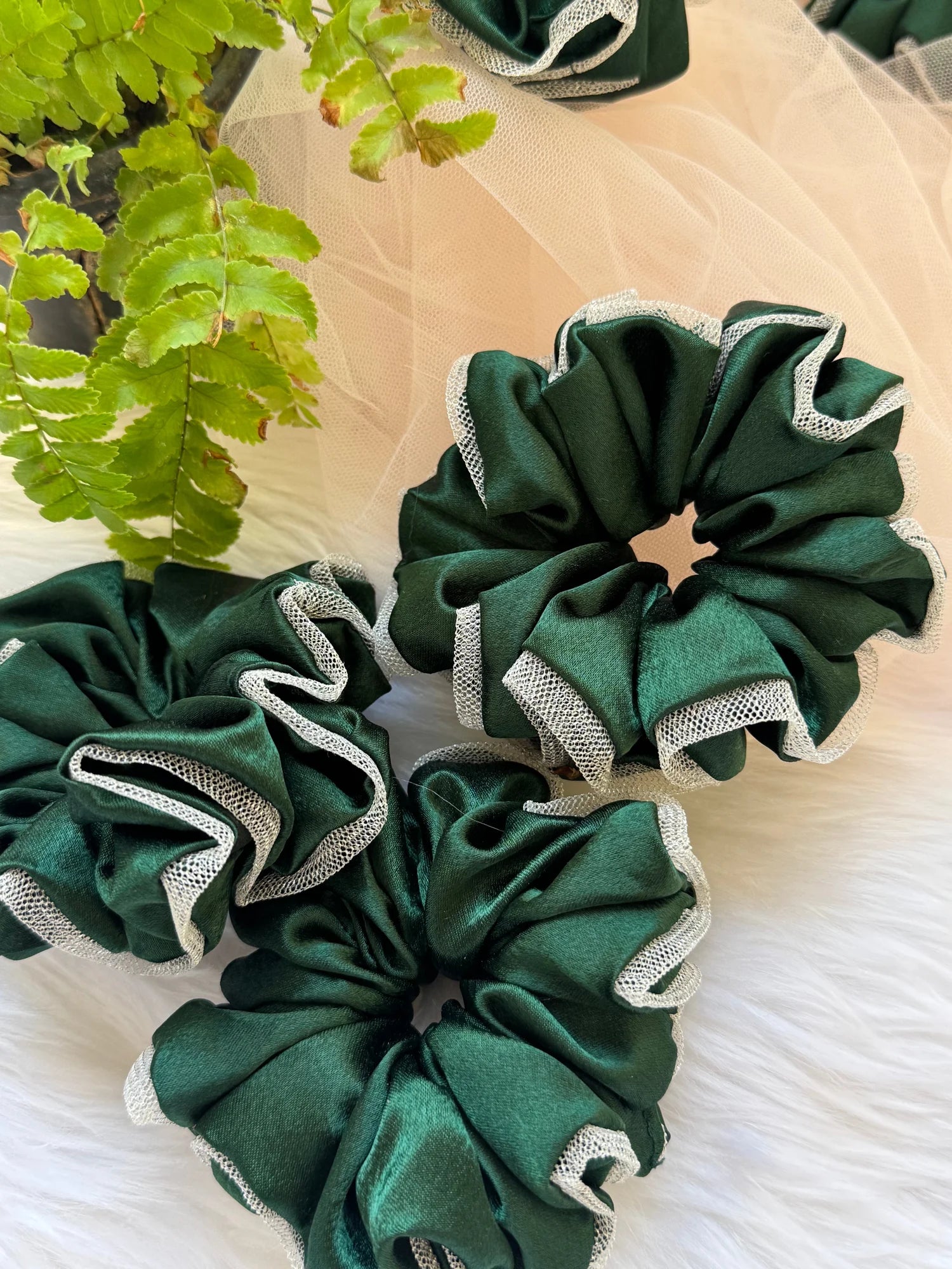 Dark green satin scrunchies with silver net borders by Bows and Bags India, handmade hair accessories displayed on white