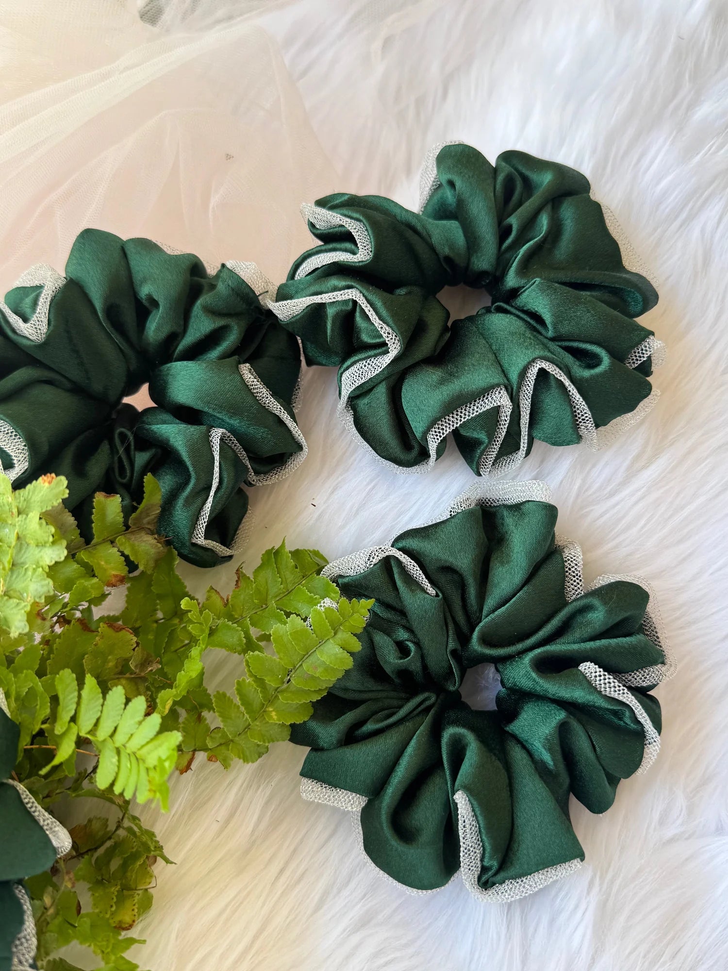 Dark green satin scrunchies with silver net border detail by Bows and Bags India, handmade hair accessories displayed on