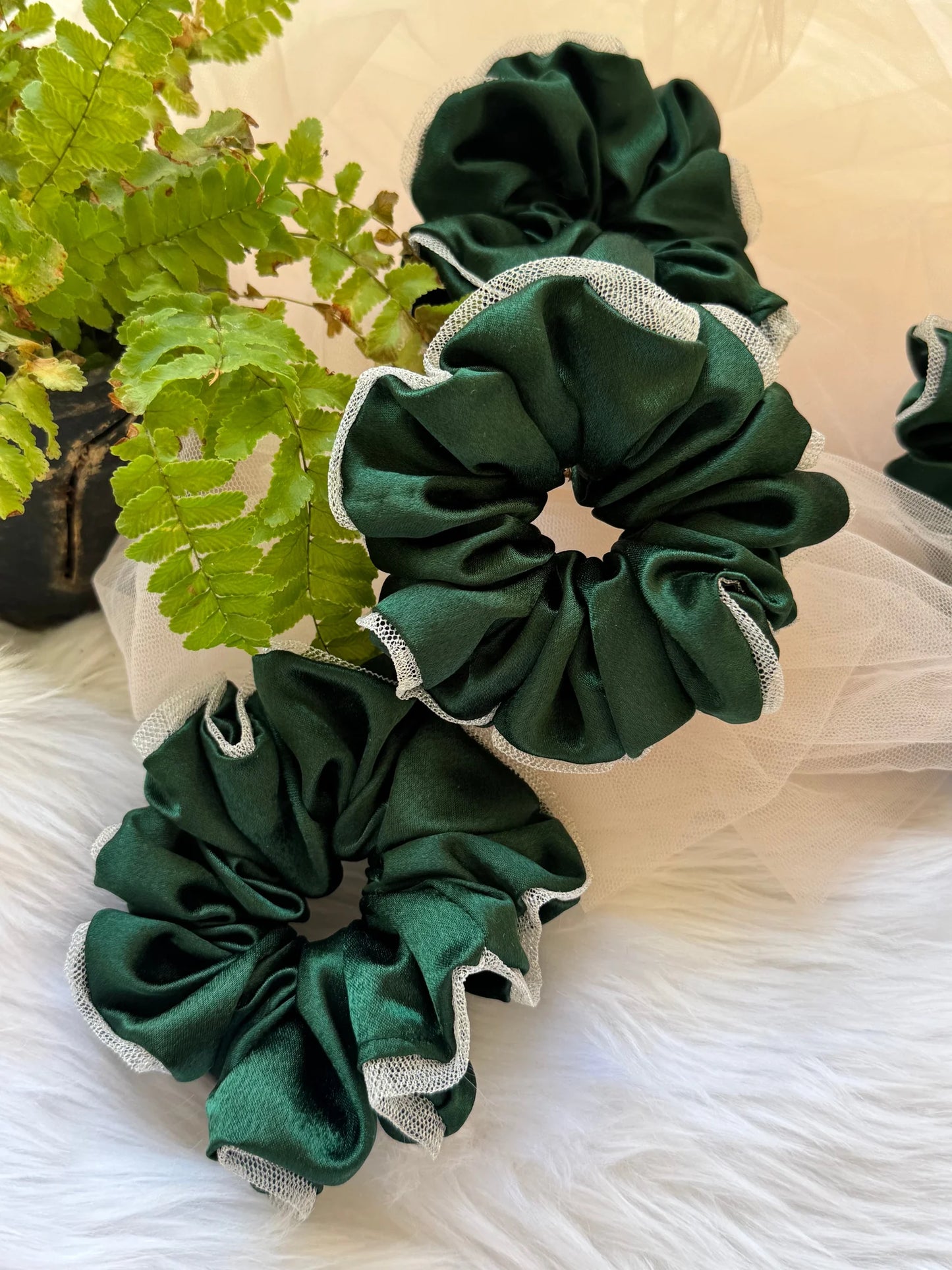 Dark green satin scrunchie with silver net border detail by Bows and Bags India, handmade hair accessory displayed on white