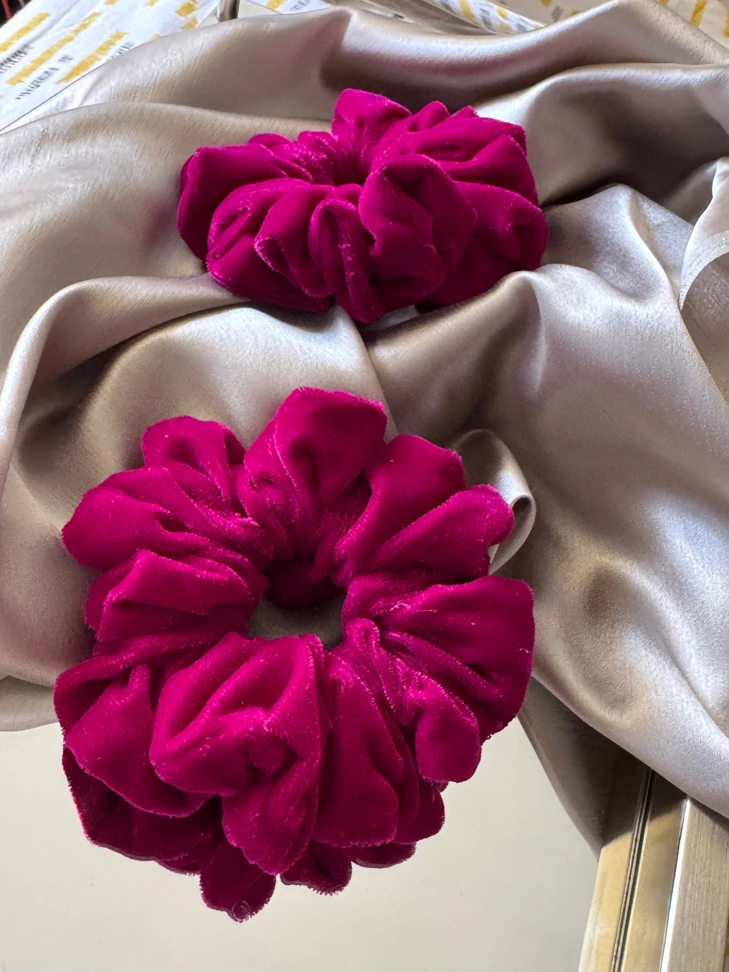 Hot pink velvet scrunchie texture detail by Bows and Bags India, premium handmade hair accessory with luxe fabric close-up