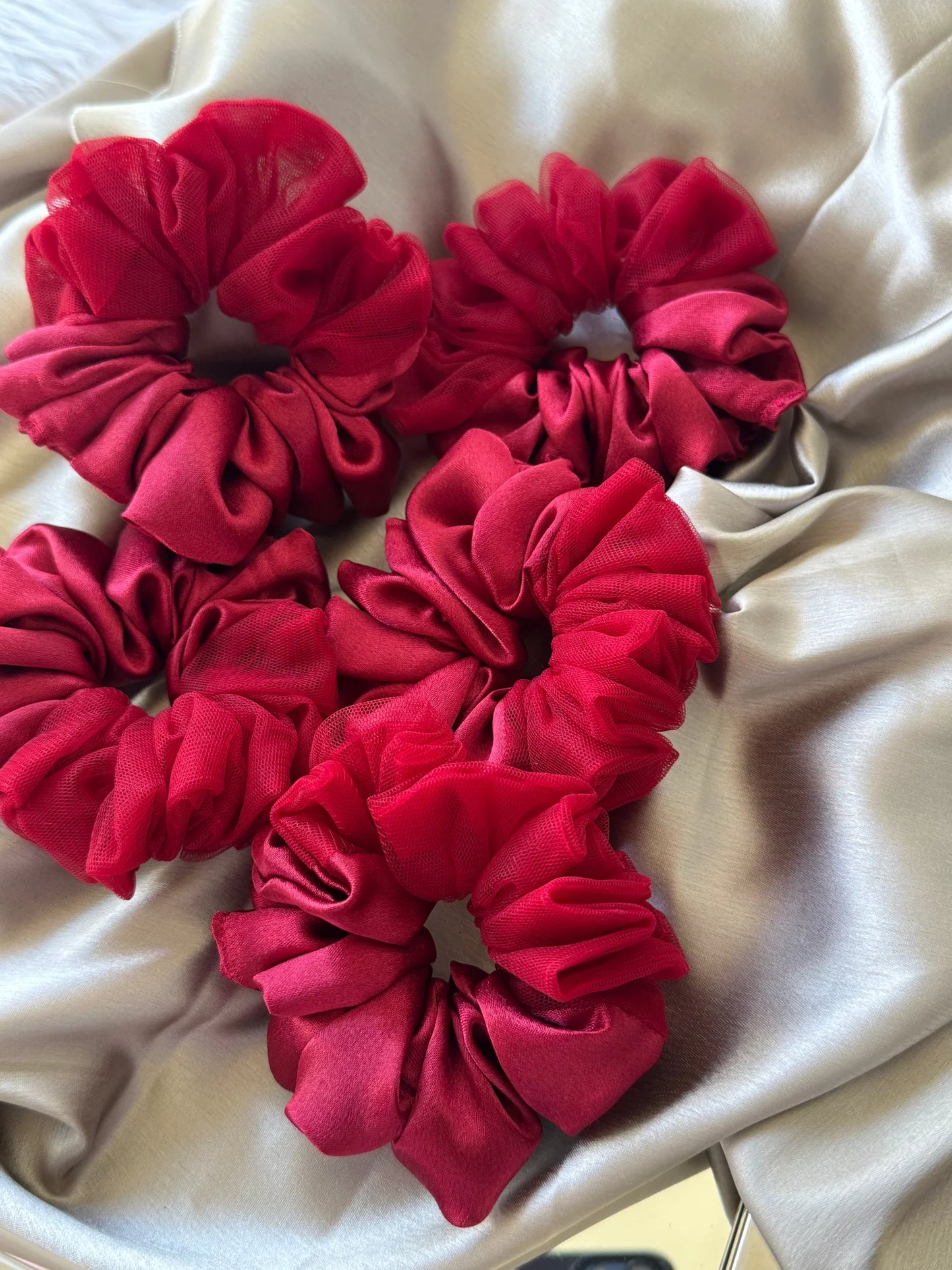 Scarlet Rose crimson red satin net scrunchies arranged on cream silk by Bows and Bags India handmade hair accessories
