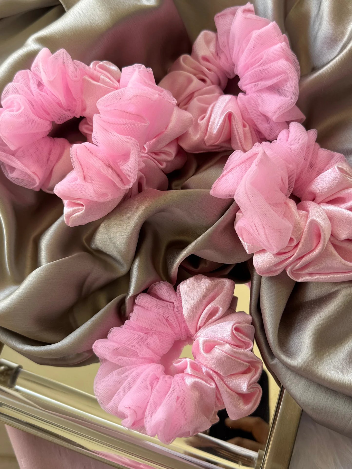 Soft baby pink satin and net scrunchies with delicate ruffled texture by Bows and Bags India, handmade hair accessories