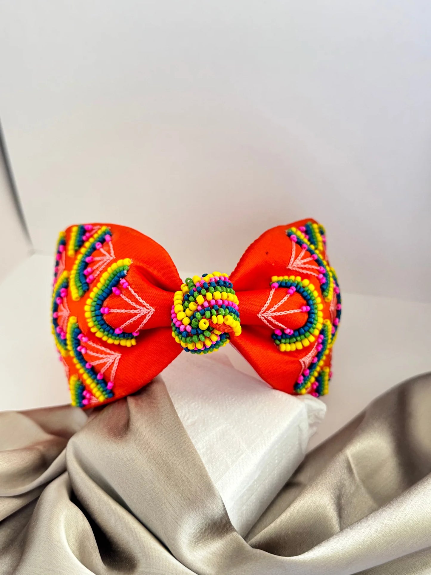 Tangerine Hawai handmade beaded satin headband with vibrant orange bow and multicolored embellishments by Bows and Bags India