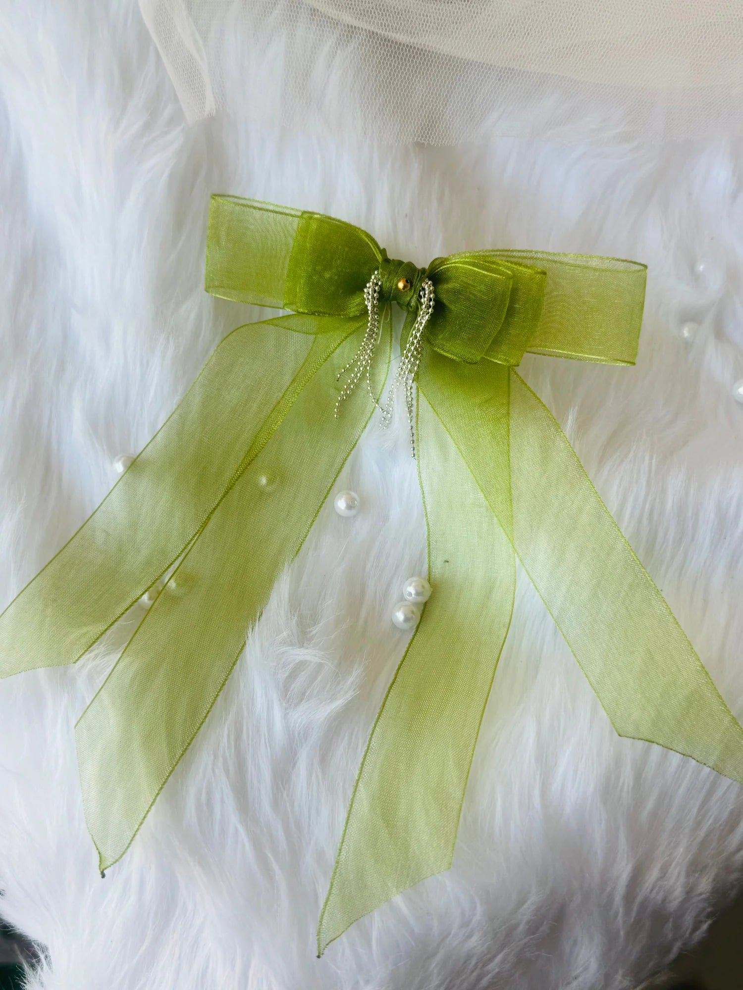 Light green organza hair bow with silver chain detailing on white fur, Bows and Bags India handmade hair clip accessory