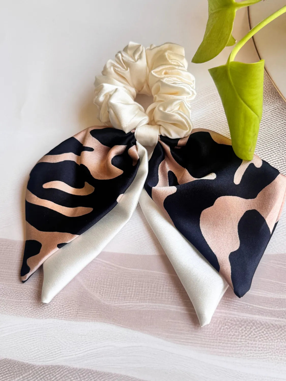 Beige satin bow with black and tan animal print dual tail scrunchie from Bows and Bags India, handmade hair accessory